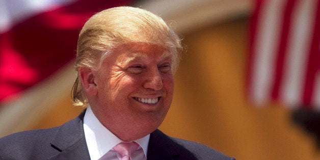 BOCA RATON, FL - APRIL 16: Billionaire Donald Trump laughs while speaking to a crowd at the 2011 Palm Beach County Tax Day Tea Party on April 16, 2011 at Sanborn Square in Boca Raton, Florida. Trump is considering a bid for the 2012 presidency and is expected to announce his running in the coming weeks. (Photo by John W. Adkisson/Getty Images)