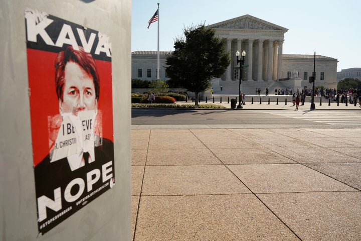 A sign against Supreme Court nominee Brett Kavanaugh is seen across from the court on Oct. 1, 2018.