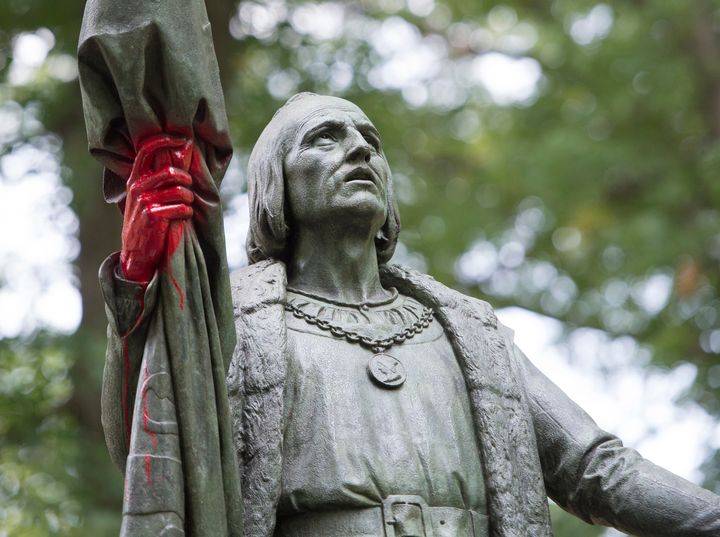 A statue of Christopher Columbus is defaced with red paint in New York City's Central Park.