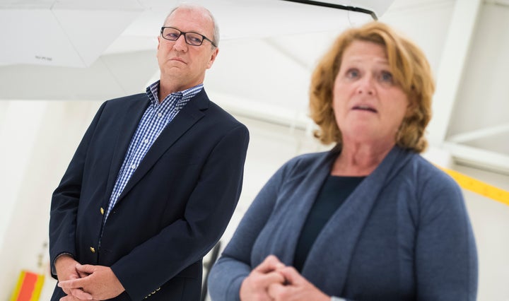 Sen. Heidi Heitkamp (D-N.D.) and her GOP challenger in November's election, Rep. Kevin Cramer, are seen at an event in their