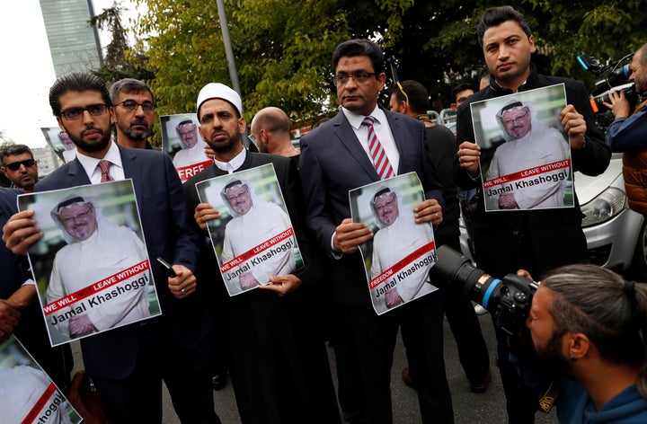 Human rights activists and friends of Saudi journalist Jamal Khashoggi hold his picture during a protest outside the Saudi Consulate in Istanbul, Turkey, Oct. 8.