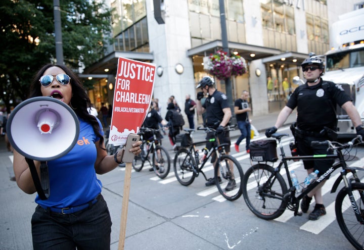 A marcher in Seattle, June 22, 2017, protesting the fatal police shooting of Charleena Lyles that month. Washington voters wi