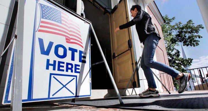 A Maine resident arrives in Kennebunk to vote in the state's primary elections, June 12, 2018. Question 1, which would&n