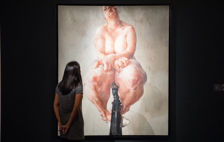 A viewer looking at "Propped" by Jenny Saville at the press preview for Sotheby's Freize week exhibition of contemporary art.