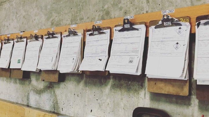 Clipboards with paper inspection sheets hang on the wall of a Washington State Department of Transportation maintenance office in Moses Lake in 2014. The agency’s maintenance field staffers now use iPads and apps to inspect everything from guardrails to drainage systems. 