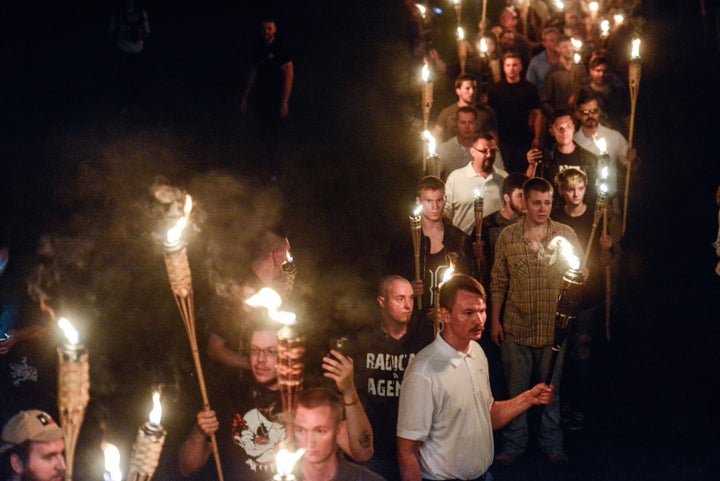 White supremacists participate in a torch-lit march on the University of Virginia campus ahead of the Unite the Right Rally in Charlottesville, Virginia on Aug. 11, 2017. 