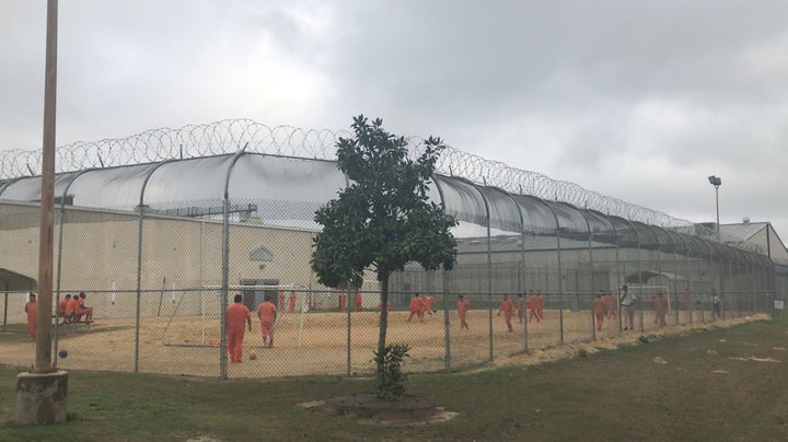 Detained immigrants play soccer behind a barbed wire fence at the Irwin County Detention Center in Ocilla, Georgia, in February 2018.