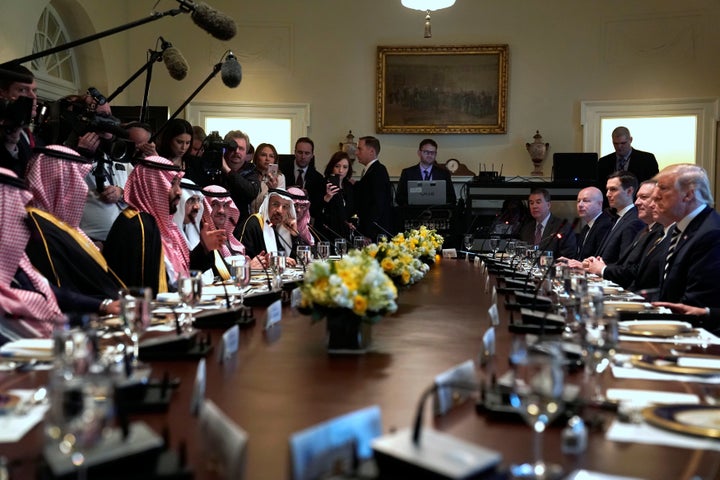 Donald Trump and Crown Prince Mohammed bin Salman sit down to a working lunch with their delegations at the White House on March 20, 2018.