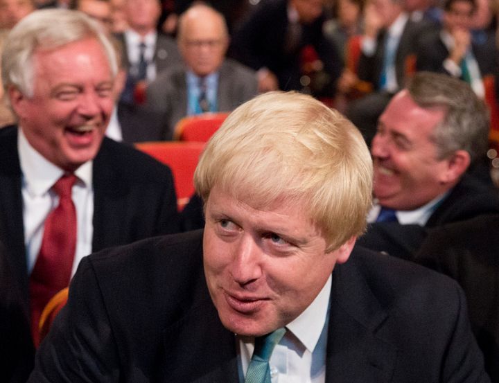 David Davis, Boris Johnson and Liam Fox have a laugh in the audience at the Conservative party conference at the International Convention Centre, ICC, Birmingham