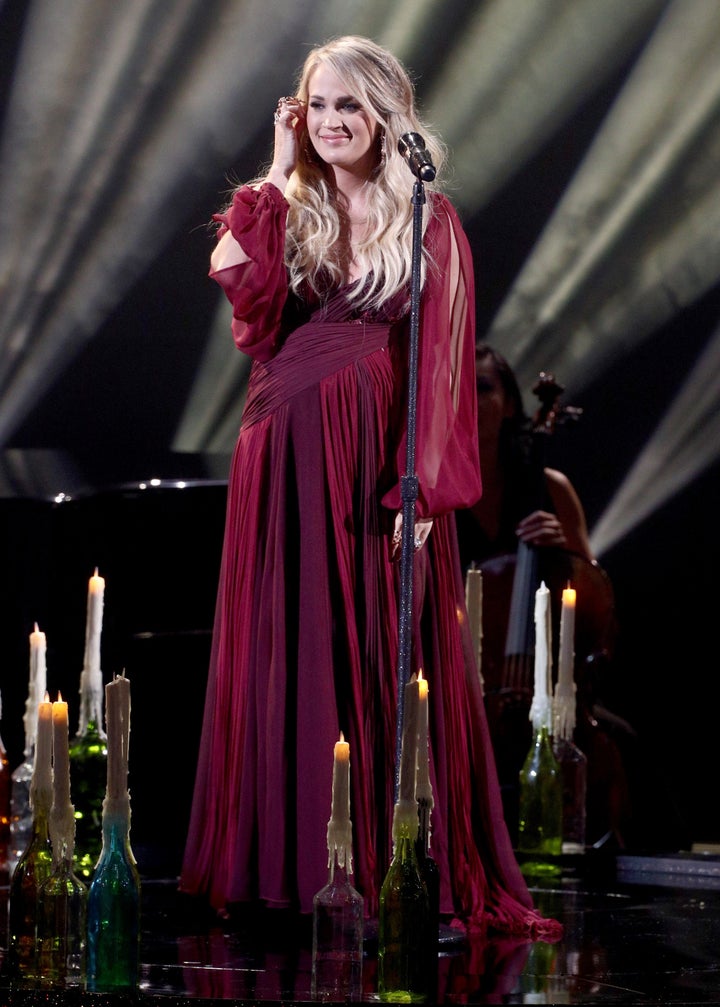 The country singer changed into a long, flowing red gown for the performance. 