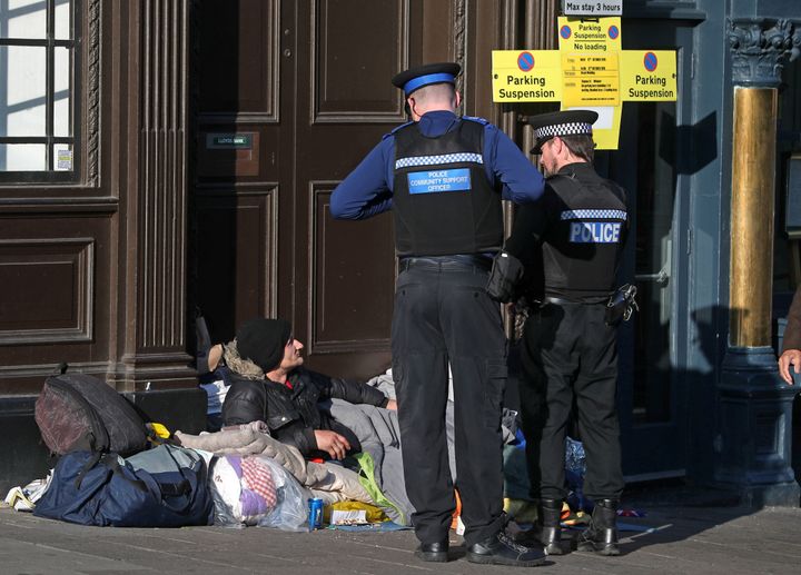 <strong>Police officers speaking to a homeless man on Wednesday</strong>