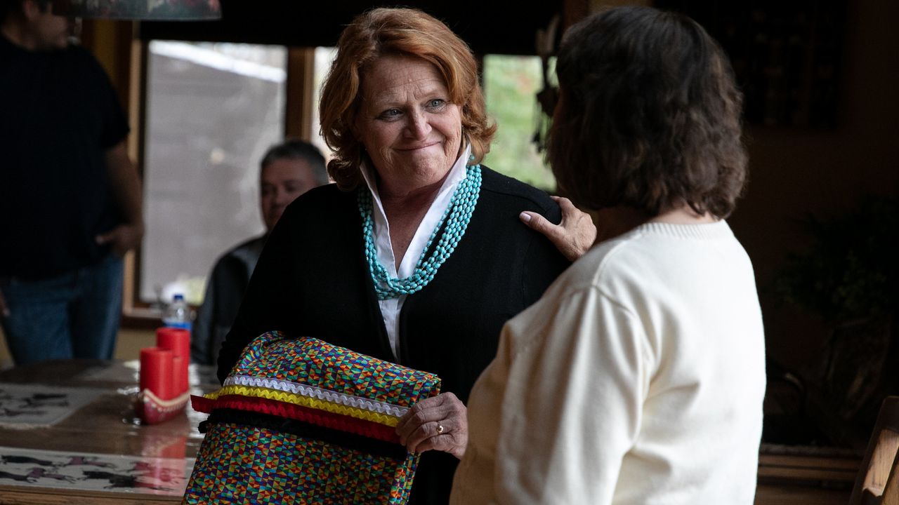 Sen. Heidi Heitkamp (D-N.D.), an underdog in her re-election bid, accepts a ribbon skirt at the home of Twila Martin-Kekahbah, a member of the Turtle Mountain Band of Chippewa.