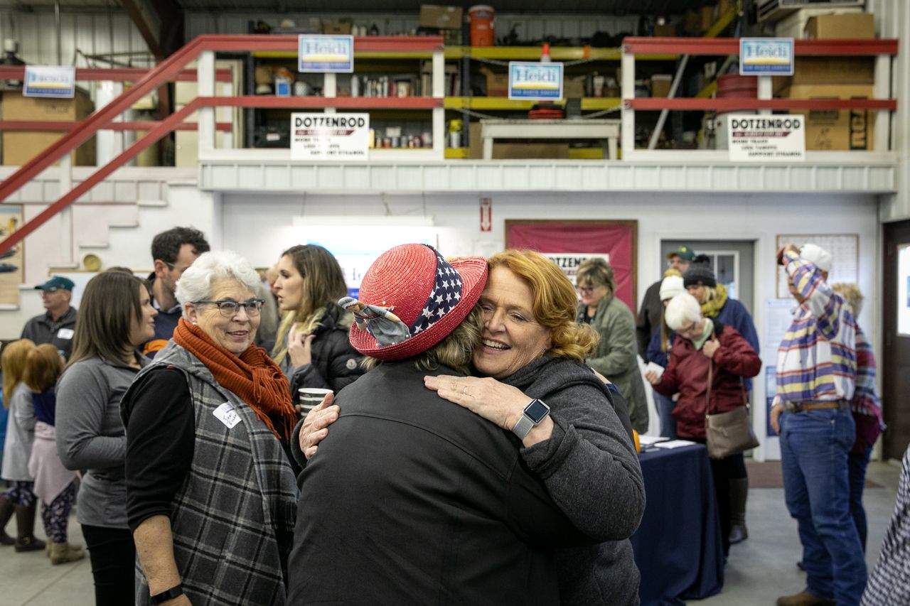 Heitkamp hugs a backer at the rally in Wyndmere.