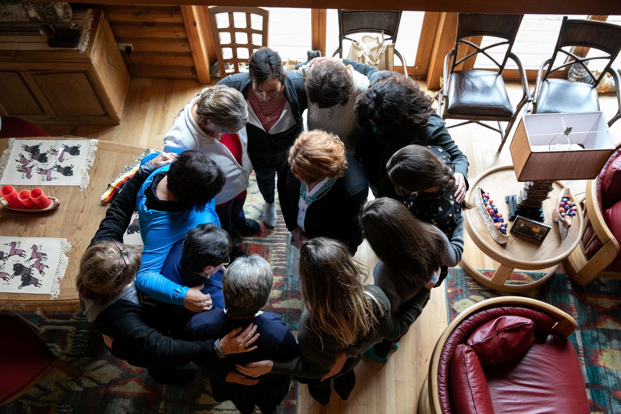 Women who met with Heitkamp at a home on the reservation of the Turtle Mountain Band of Chippewa Indians surrounded her to offer a blessing.