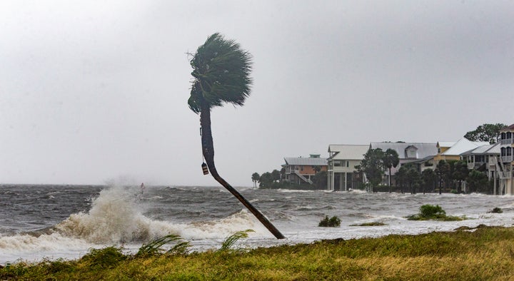 The storm surge and waves from Hurricane Michael batter homes in Shell Point Beach, Florida, Oct. 10.