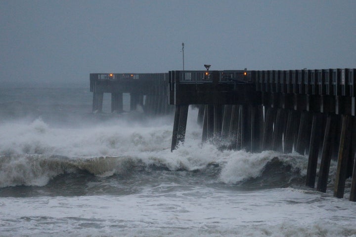 Waves crash along a pier as Hurricane Michael approaches Panama City Beach, Florida, on Oct. 10.