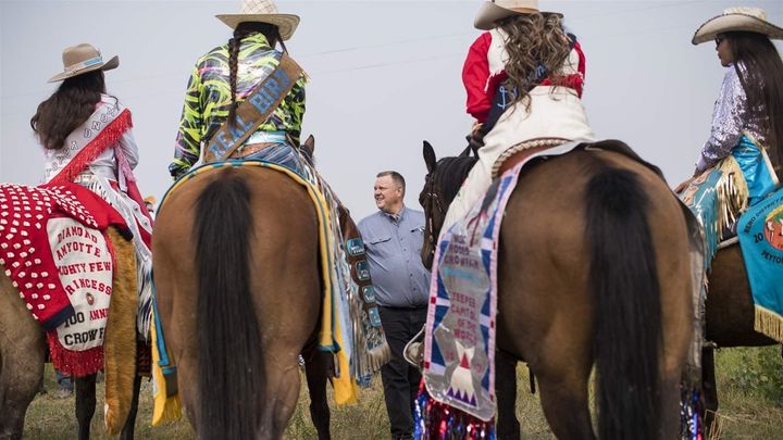 Montana Democratic Sen. Jon Tester talks with constituents before a parade in Crow Agency, Montana. Along with key races, Big Sky Country voters will decide whether to ban the practice of collecting ballots. 