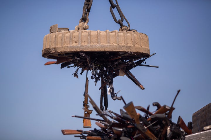 An electromagnet is used to pick up some of approximately 3,500 confiscated guns to be melted down at Gerdau Steel Mill on July 19, 2018 in Rancho Cucamonga, California. The weapons were seized in criminal investigations, probation seizures and gun buyback events, and will be recycled into steel rebar for the construction of highways and bridges. (Photo by David McNew/Getty Images)