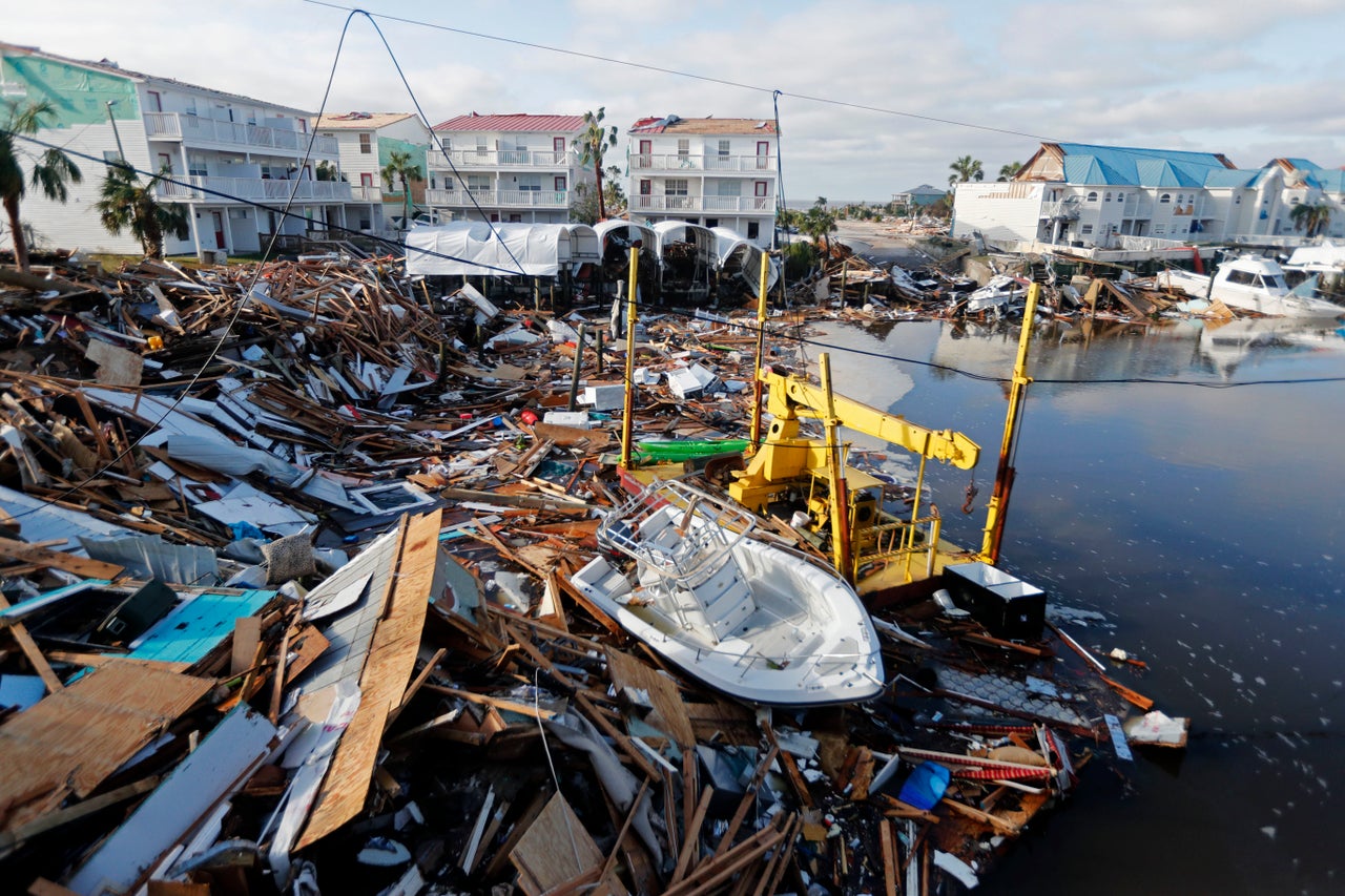 A boat sits amidst debris in the aftermath of Hurricane Michael in Mexico Beach, Fla.