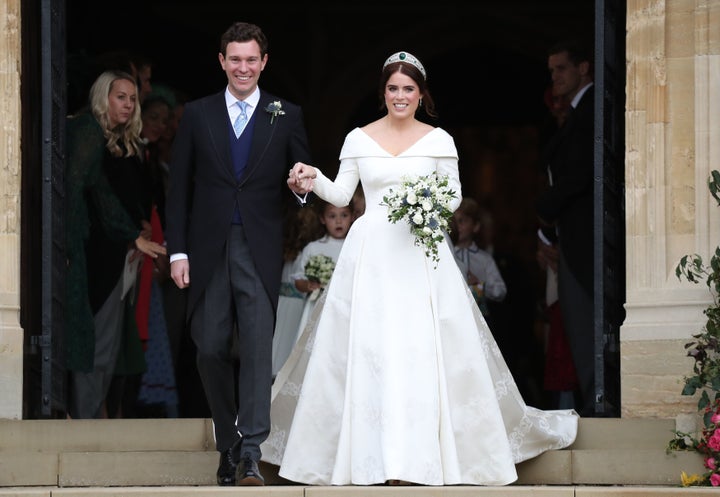 Princess Eugenie of York and Jack Brooksbank leave the St. George's Chapel at Windsor Castle after tying the knot on Friday.