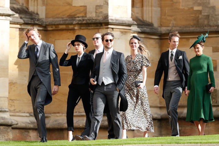 Delevingne held onto her hat as the gusty wind conditions caused a few guests to lose their fascinators. 