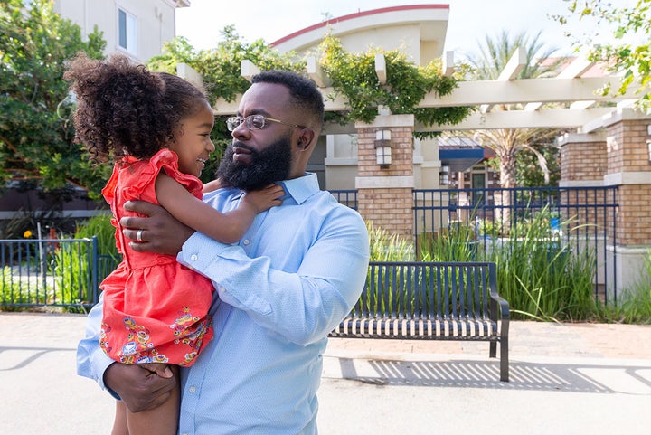 <p>Walter Daniel plays with daughter Victoria near their apartment in Dublin, Calif., on Sept. 27, 2018. Daniel has been raising Victoria as a single dad for four years. After the death of his wife, Moani, he left the Coast Guard and returned to college to study to become a high school teacher. </p>