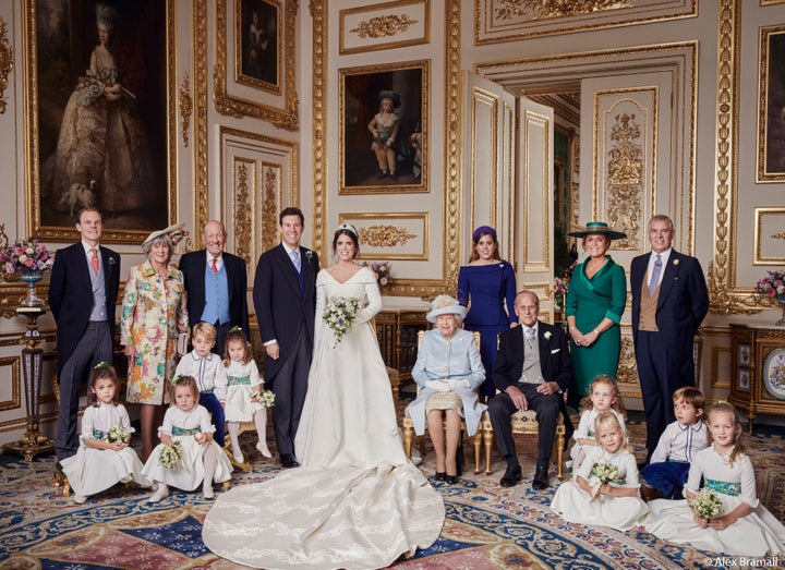 The newlyweds pose with (from left to right, back row): Thomas Brooksbank (Jack's brother); Nicola Brooksbank and George Brooksbank (his parents); Princess Beatrice; Sarah, Duchess of York; and her former husband, His Royal Highness The Duke of York. Middle row: Prince George, Princess Charlotte, Queen Elizabeth II and Prince Phillip, with the rest of the young pages and bridesmaids.