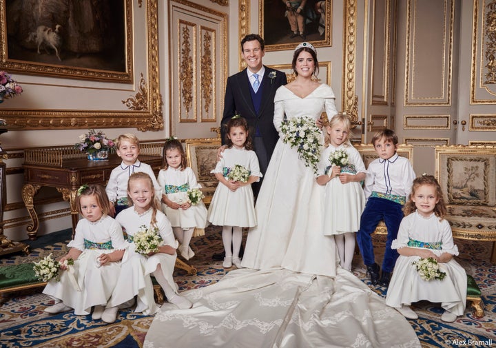 The newlyweds pose with their pages and bridesmaids. Prince George smiles in the back row with his sister, Princess Charlotte. Brooksbank rests his hand on the shoulder of Theodora Williams, daughter of singer Robbie Williams and Ayda Field.