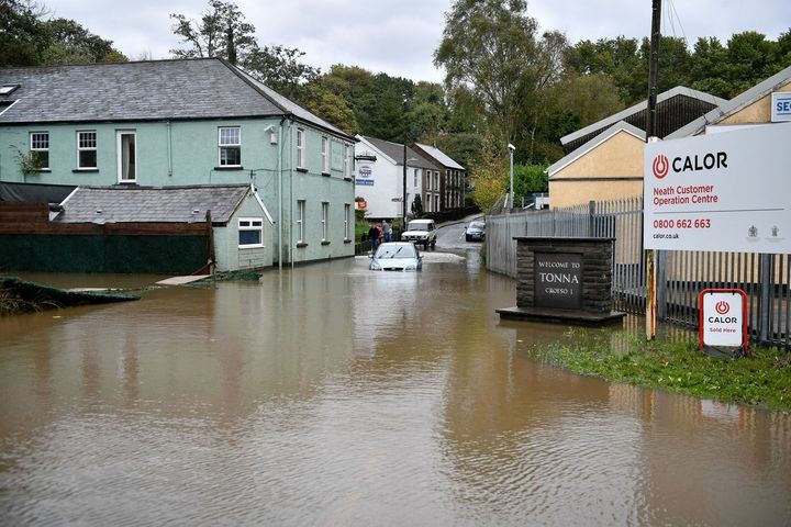 A car is stranded in floodwater in Tonna near Aberdulais, Neath, South Wales.