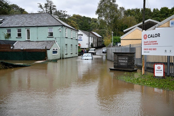 <strong>A car is stranded in floodwater in Tonna near Aberdulais, Neath, South Wales.</strong>