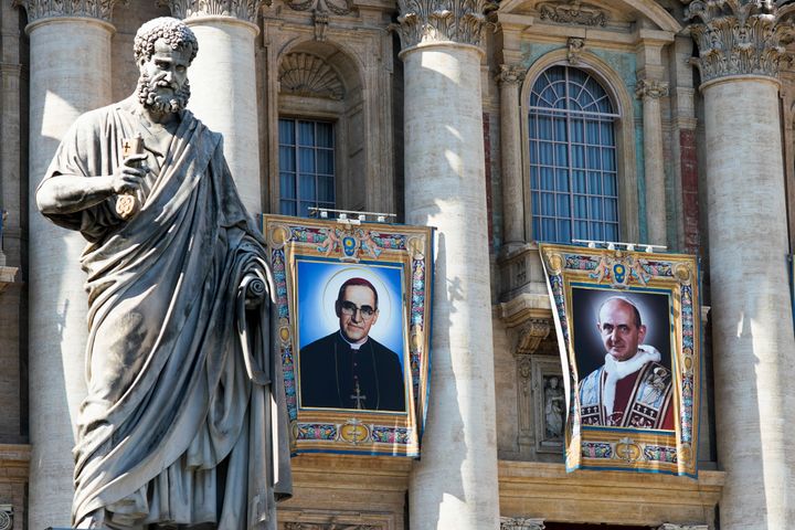 Pope Paul VI and El Salvador's Archbishop Oscar Romero pictures are seen during a Mass for their canonization at the Vatican, October 14, 2018. 