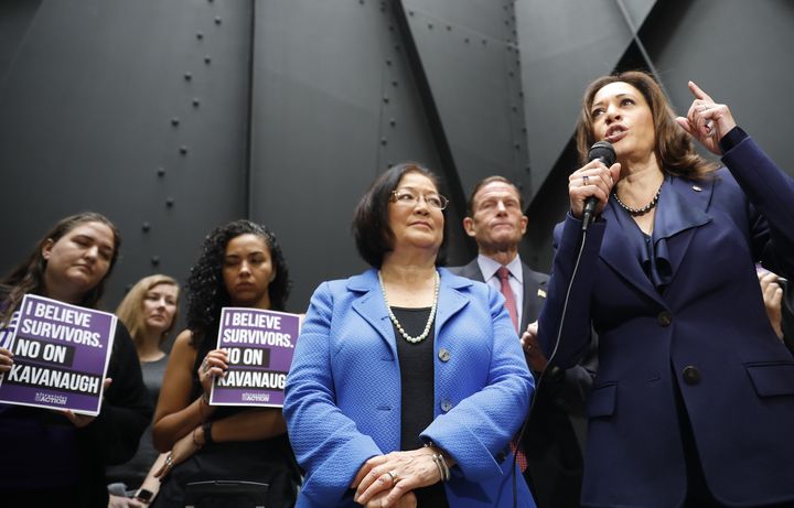 Senators Mazie Hirono (center) and Kamala Harris speak at a rally about Brett Kavanaugh's confirmation hearings and the sexual assault allegations against the judge.