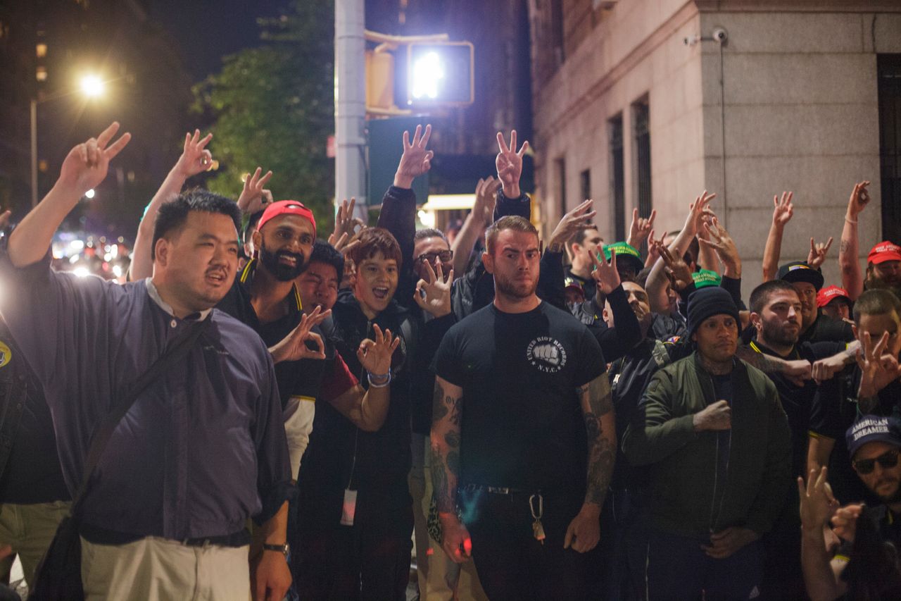 Members of the Proud Boys pose for a group photo on the night of their attack outside the Metropolitan Republican Club in New York City.