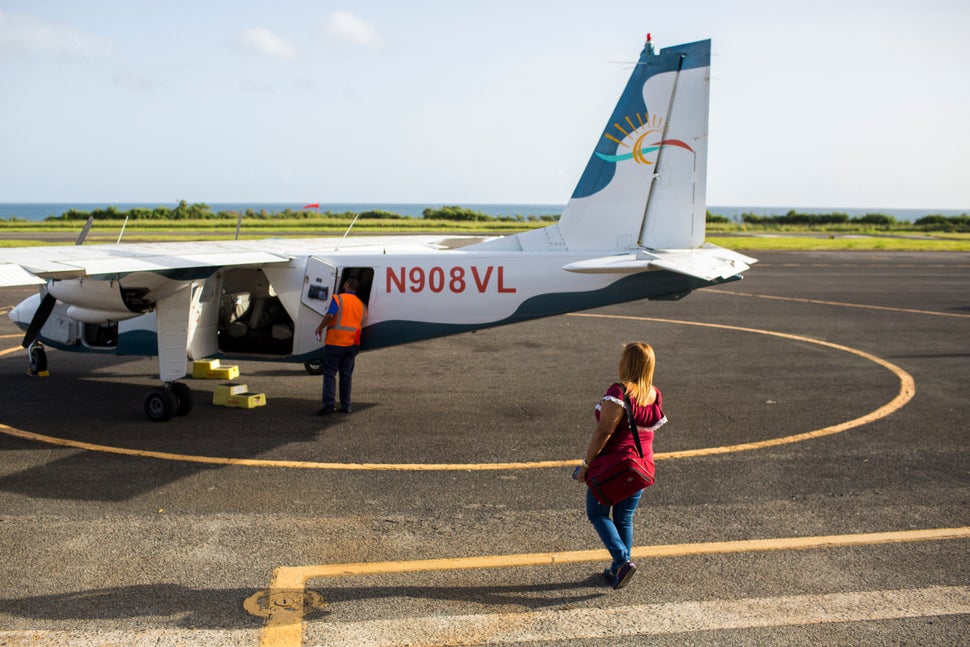 Leyla Rivera Acosta walks toward the small eight-seat aircraft that transports her and other dialysis patients in Vieques thr