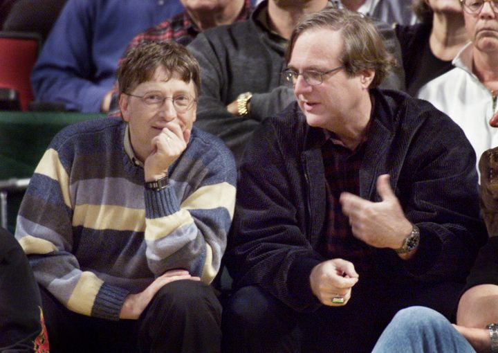 Microsoft co-founders Bill Gates (l) and Paul Allen chat at courtside during the NBA game between the Seattle SuperSonics and the Portland Trailblazers at Key Arena in Seattle in 2003