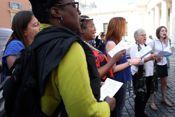 Members of a women's group sing in protest at the Synod Hall before the opening of the Synod of Bishops on 'Young People' on October 3, 2018 in Vatican City, Vatican.