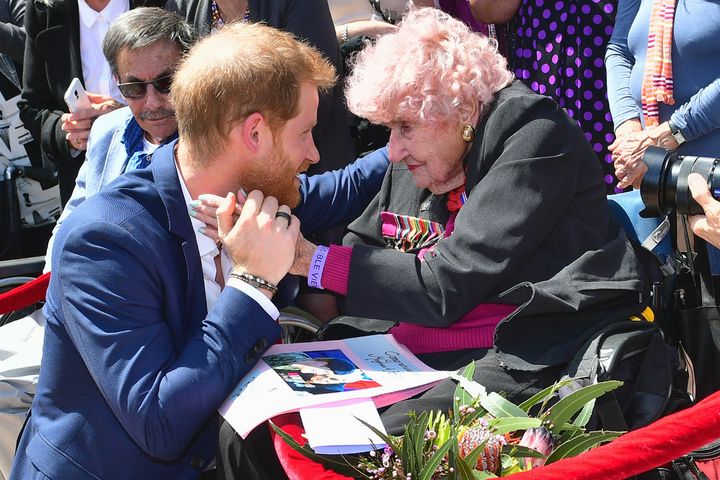 Britain's Prince Harry greets Daphne Dunne again in Sydney.