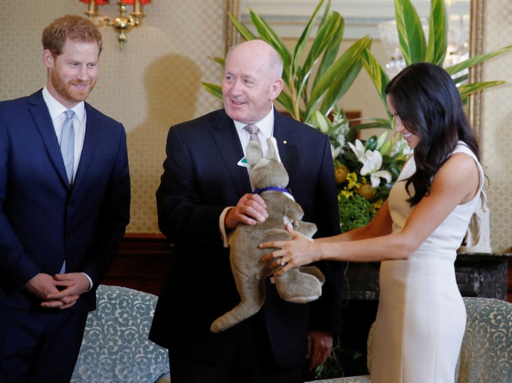 Meghan admiring the stuffed animal. 