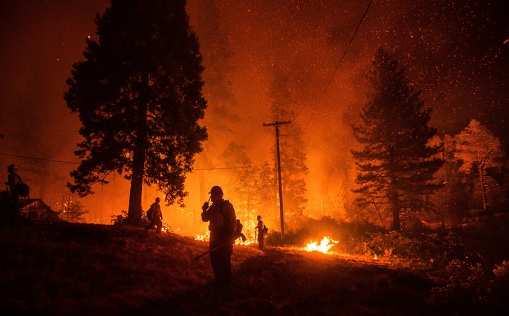 Firefighters monitor a backfire while battling the Delta fire in the Shasta-Trinity National Forest in California in Septembe