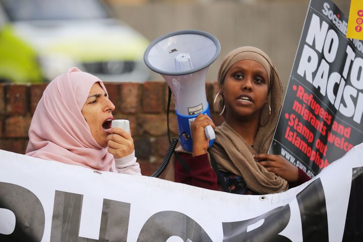 People protest in Uxbridge, England, on Aug. 9, 2018, against comments that British politician Boris Johnson made demeaning Muslim women who wear burqas.