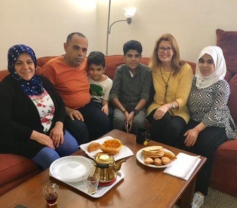 The author (second from right) with one of her current pediatric hospice families. The family is originally from Syria and has been negatively affected by the Trump administration's ban on travel from several Muslim-majority countries.