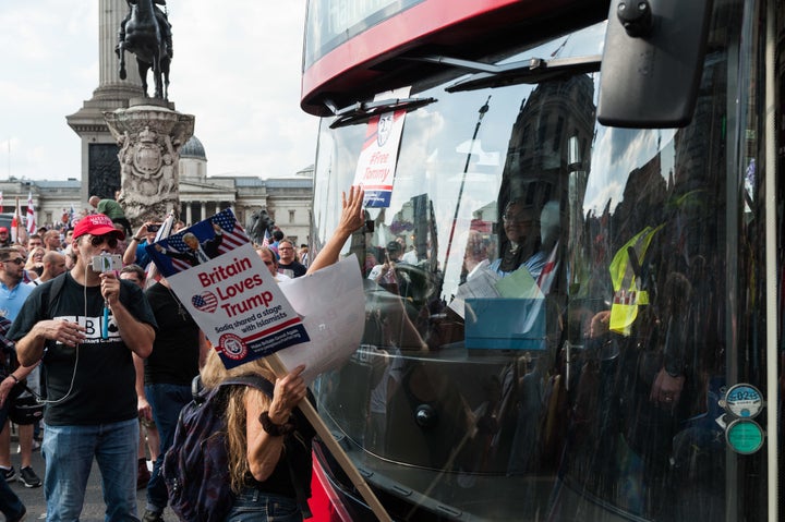 Protesters at a far-right rally in central London block the path of a public bus driven by a Muslim woman on July 14, 2018.