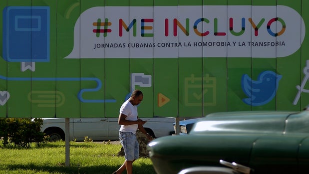 A Cuban walks past a poster against homophobia and transphobia in Havana, on September 20, 2018. - The national referendum to ratify Cuba's new constitution will take place on February 24, 2019, the document would provide a legal path for same-sex marriage, an important demand of the socialist island's LGBT community. (Photo by YAMIL LAGE / AFP)        (Photo credit should read YAMIL LAGE/AFP/Getty Images)