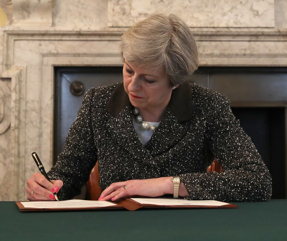 Prime Minister Theresa May signs the official letter to European Council President Donald Tusk invoking Article 50 and the United Kingdom's exit from the European Union 