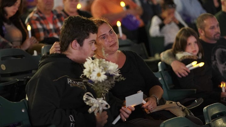 <p>Kimberly Ruediger holds her son Gabriel, as they participate in an October 2017 candlelight vigil in Camden, New Jersey, in remembrance of those who have died from drug overdoses. The opioid epidemic is killing nearly 200 people every day. Nationwide, almost half of the deaths involved the powerful synthetic drug fentanyl in 2017. </p>