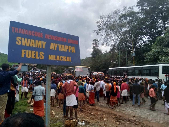 Protesters search vehicles for women heading toward the Sabarimala temple after an Indian Supreme Court revoked a ban on women's entry to the ancient site.