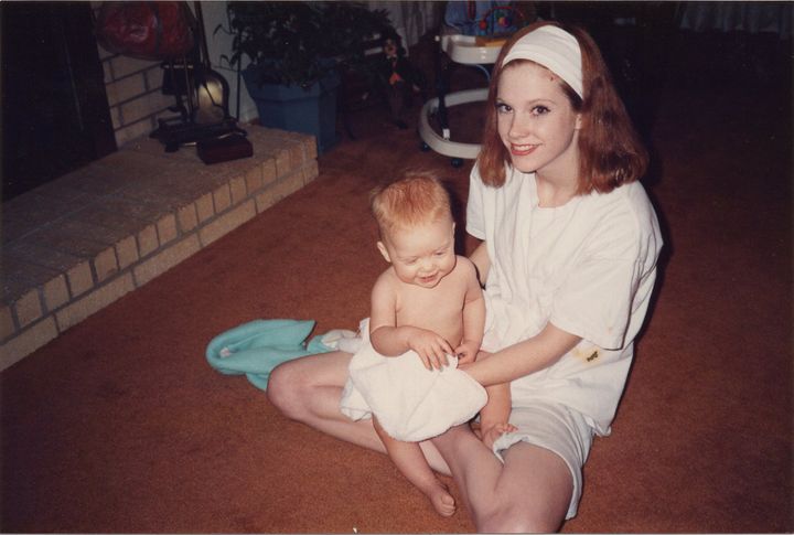 Julie Oliver as a teenager, with her then-infant eldest daughter, Nicki.