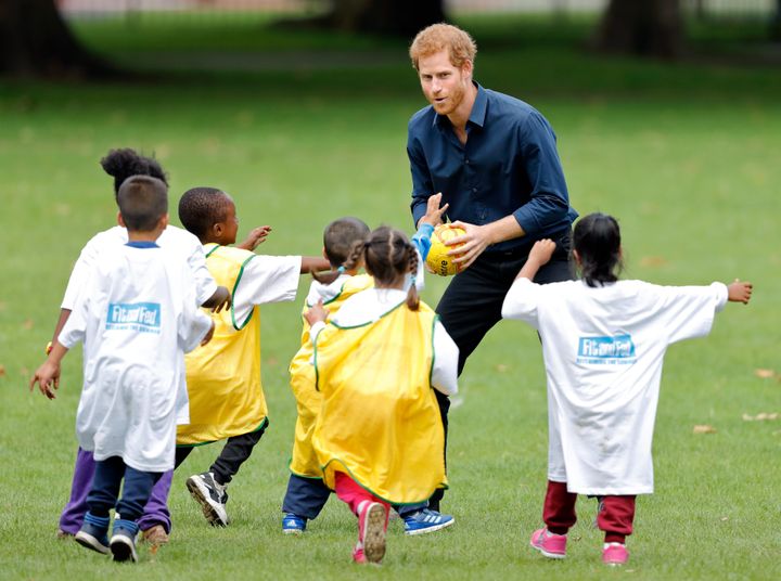 Prince Harry plays handball with children taking part in a StreetGames 'Fit and Fed' summer holiday activity session in Central Park, East Ham on July 28, 2017 in London, England. 