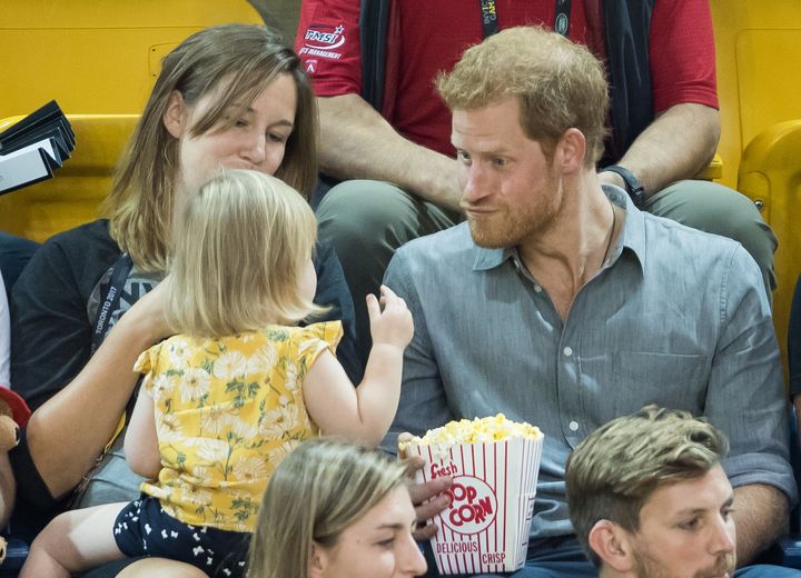 Prince Harry sits with David Henson's wife Hayley Henson and daughter Emily Henson at the Sitting Volleyball Finals on day 5 of the Invictus Games Toronto 2017 on September 27, 2017 in Toronto, Canada. 