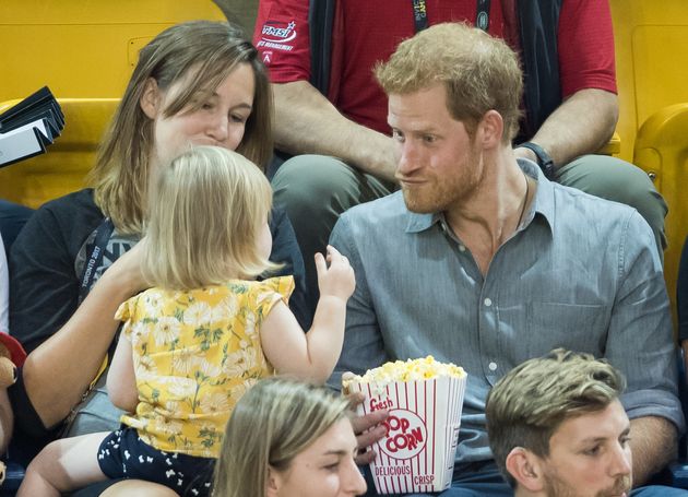 Prince Harry sits with David Henson's wife Hayley Henson and daughter Emily Henson at the Sitting Volleyball Finals on day 5 of the Invictus Games Toronto 2017 on September 27, 2017 in Toronto, Canada. 